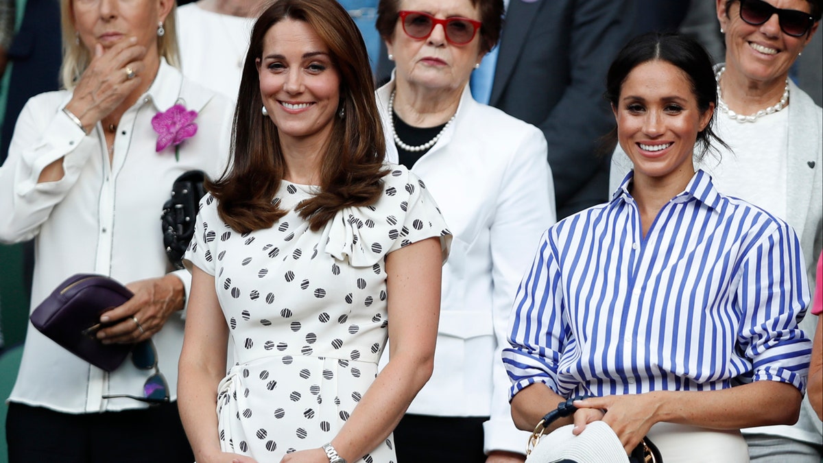 Kate, Duchess of Cambridge and Meghan, Duchess of Sussex, right, watch the women's singles final match between Serena Williams of the US and Angelique Kerber of Germany at the Wimbledon Tennis Championships, in London, Saturday July 14, 2018. (Nic Bothma, Pool via AP)