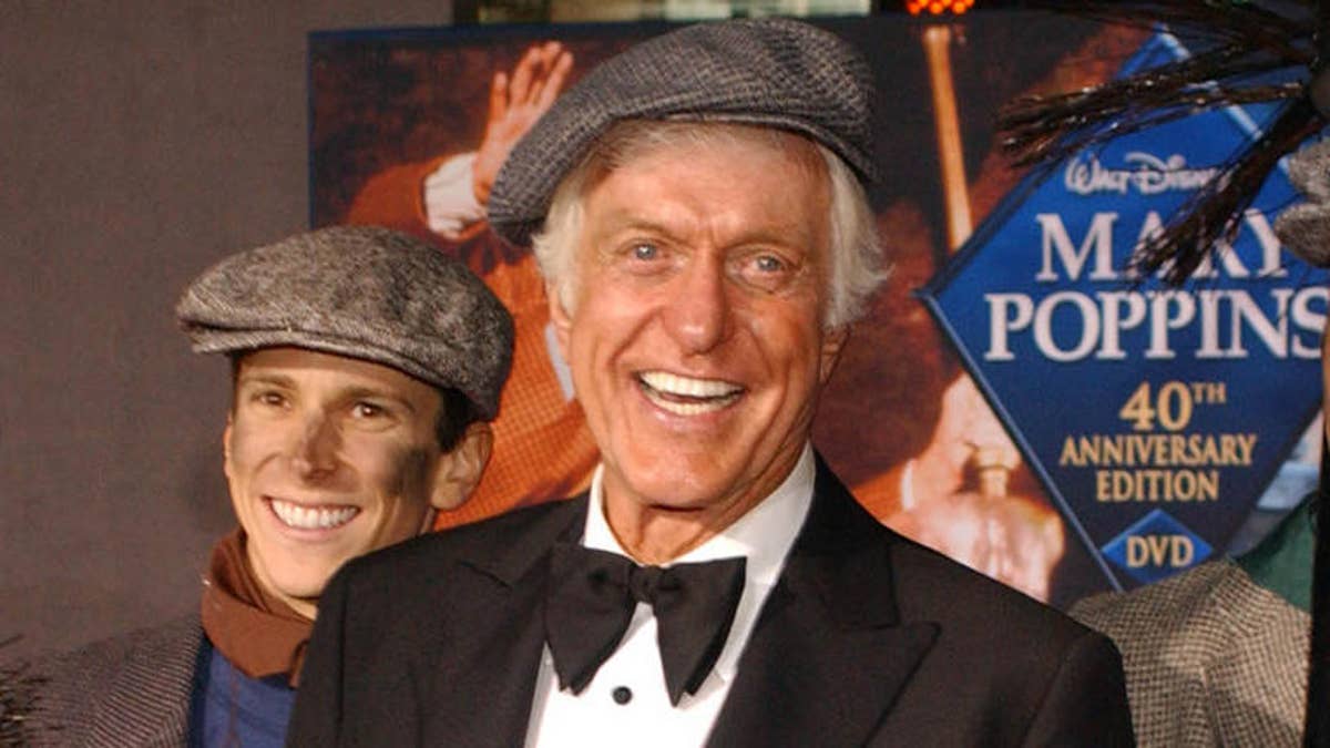 Dick Van Dyke poses with chimney sweeps during arrivals to the 40th anniversary and re-premiere of Mary Poppins at the El Capitan Theatre in Los Angeles, Tuesday, Nov. 30, 2004. (AP Photo/Ann Johansson)                               