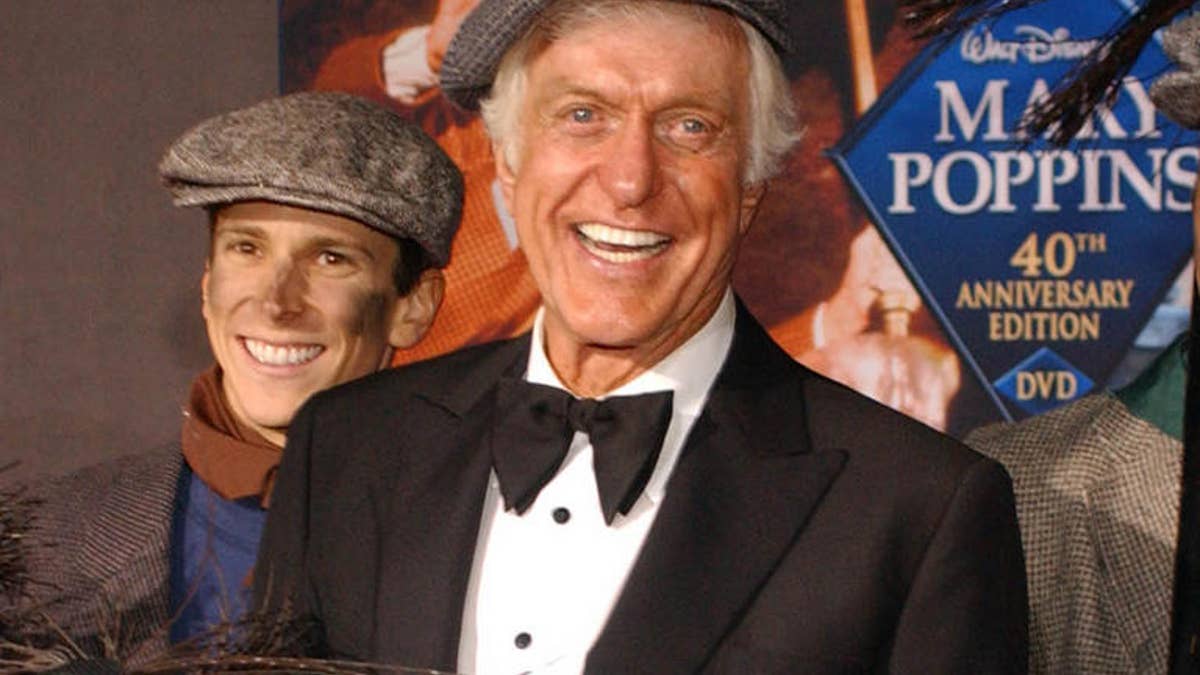 Dick Van Dyke poses with chimney sweeps during arrivals to the 40th anniversary and re-premiere of Mary Poppins at the El Capitan Theatre in Los Angeles, Tuesday, Nov. 30, 2004. (AP Photo/Ann Johansson)                               