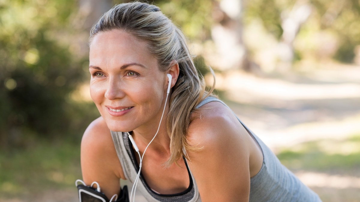 mature woman running middle age fitness istock