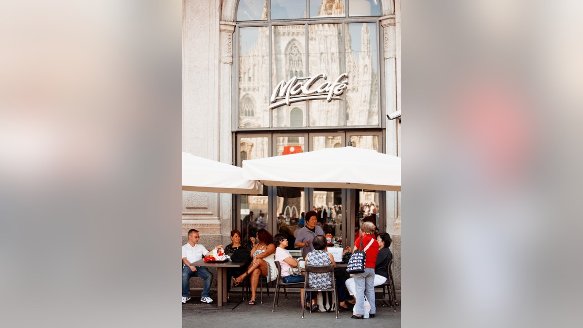 McCafe at Piazza del Duomo with Cathedral reflection, Milan, Italy