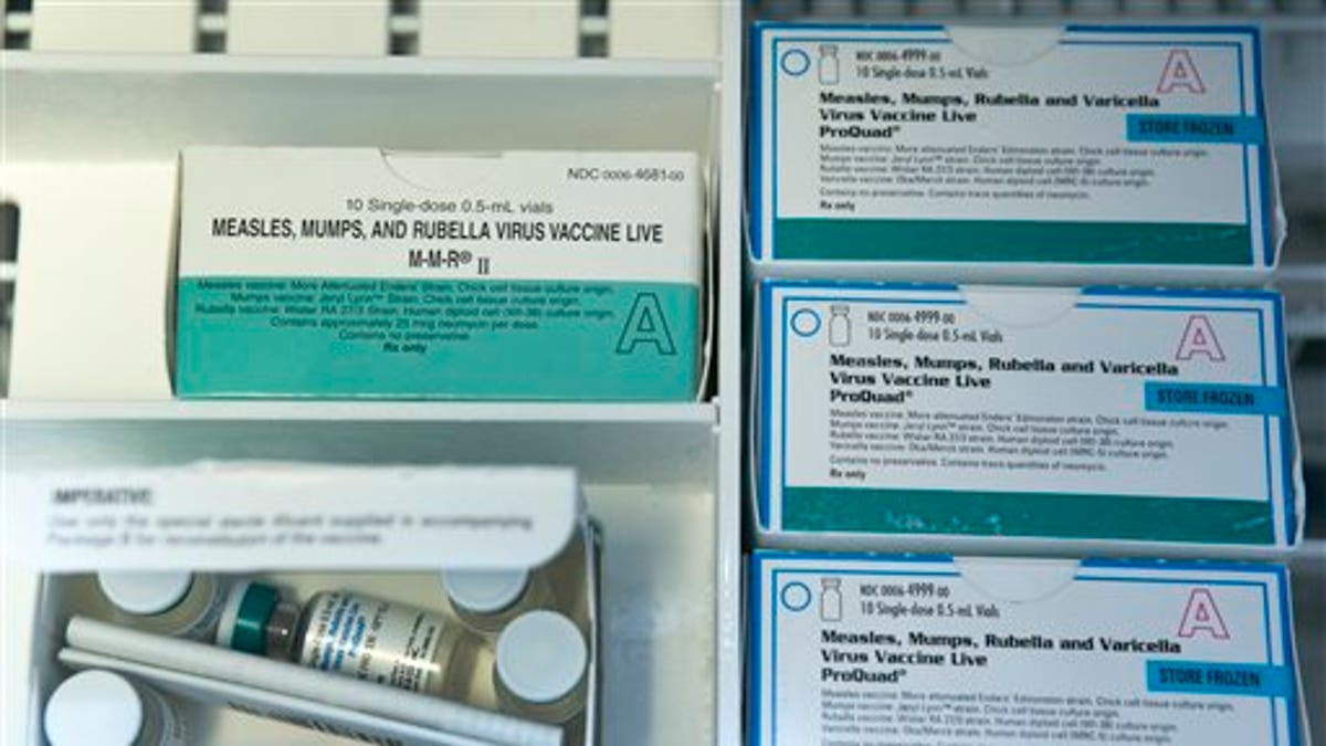 This Thursday, Jan. 29, 2015, file photo, shows boxes of the measles, mumps and rubella virus vaccine (MMR) and measles, mumps, rubella and varicella vaccine inside a freezer at a doctor's office in Northridge, Calif. (AP Photo/Damian Dovarganes, File)