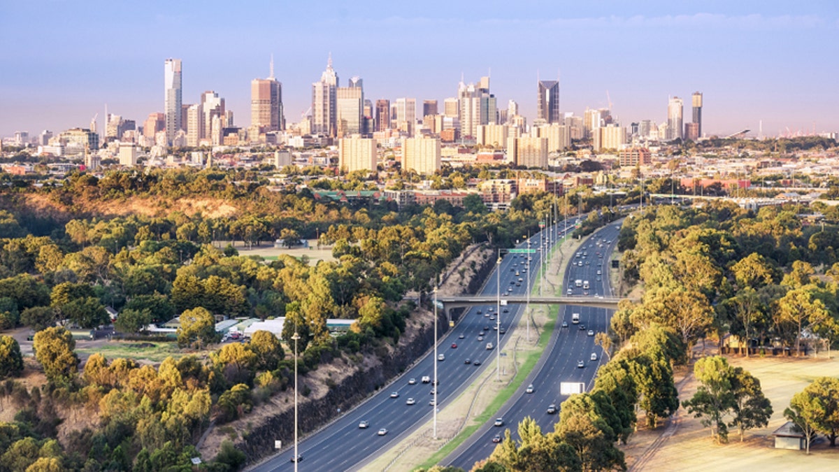 Aerial View over morning commuters towards the city of Melbourne from a hot air baloon, taken at dawn. Melbourne is the capital of Victora State, Australia