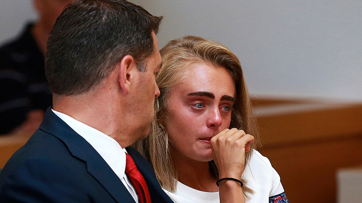 Michelle Carter awaits her sentencing in a courtroom in Taunton, Mass., Thursday, Aug. 3, 2017, for involuntary manslaughter for encouraging Conrad Roy III to kill himself in July 2014. Carter was sentenced Thursday to 15 months in jail for involuntary manslaughter.(Matt West/The Boston Herald via AP, Pool)
