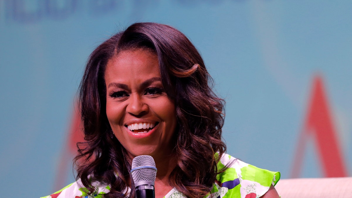 Former first lady Michelle Obama speaks at the American Library Association annual conference in New Orleans, Friday, June 22, 2018. (AP Photo/Gerald Herbert)