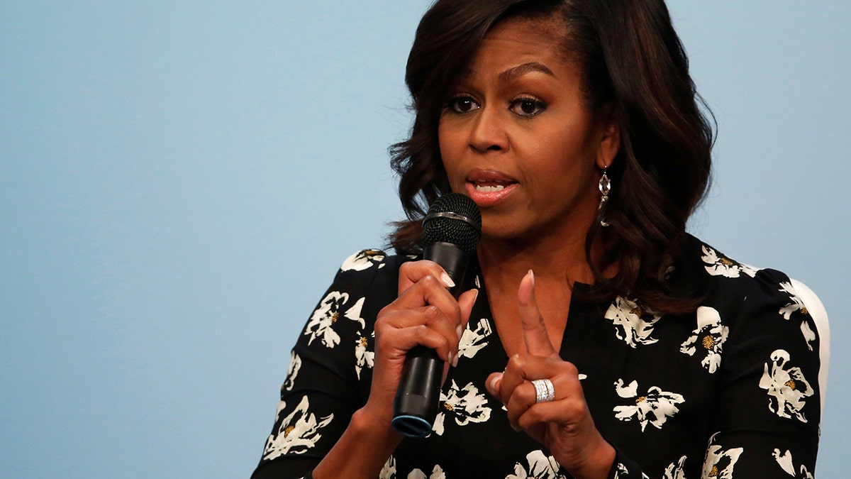 U.S. first lady Michelle Obama participates in a forum on girls' education at the Newseum in Washington, U.S. October 11, 2016. REUTERS/Jonathan Ernst - D1AEUGKFOVAB