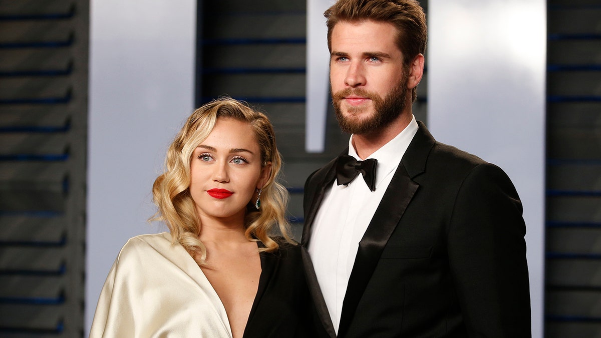 Miley Cyrus and Liam Hemsworth arrive at the 2018 Vanity Fair Oscar Part on March 04, 2018.