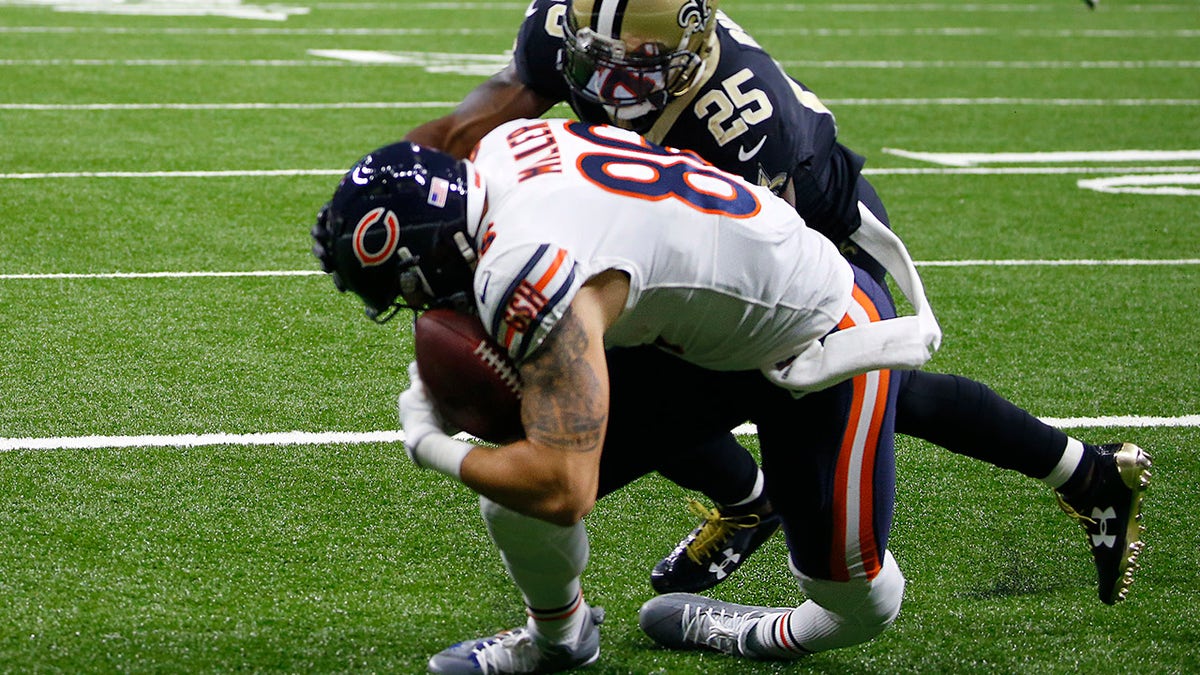 EDS NOTE: GRAPHIC CONTENT - Chicago Bears tight end Zach Miller (86) injures his leg as pulls in a touchdown reception, that was ruled incomplete upon review, as New Orleans Saints defensive back Rafael Bush (25) covers, in the second half of an NFL football game in New Orleans, Sunday, Oct. 29, 2017. (AP Photo/Butch Dill)