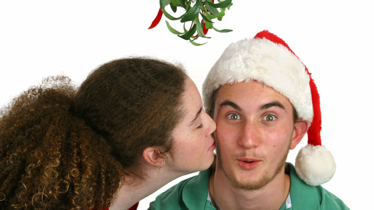 Why A Kiss Under The Mistletoe Is A Christmas Tradition