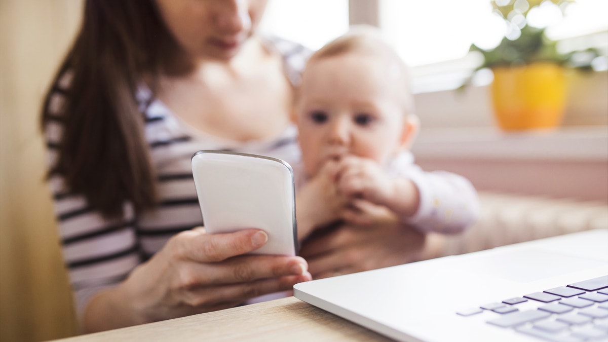 mom with baby and smartphone