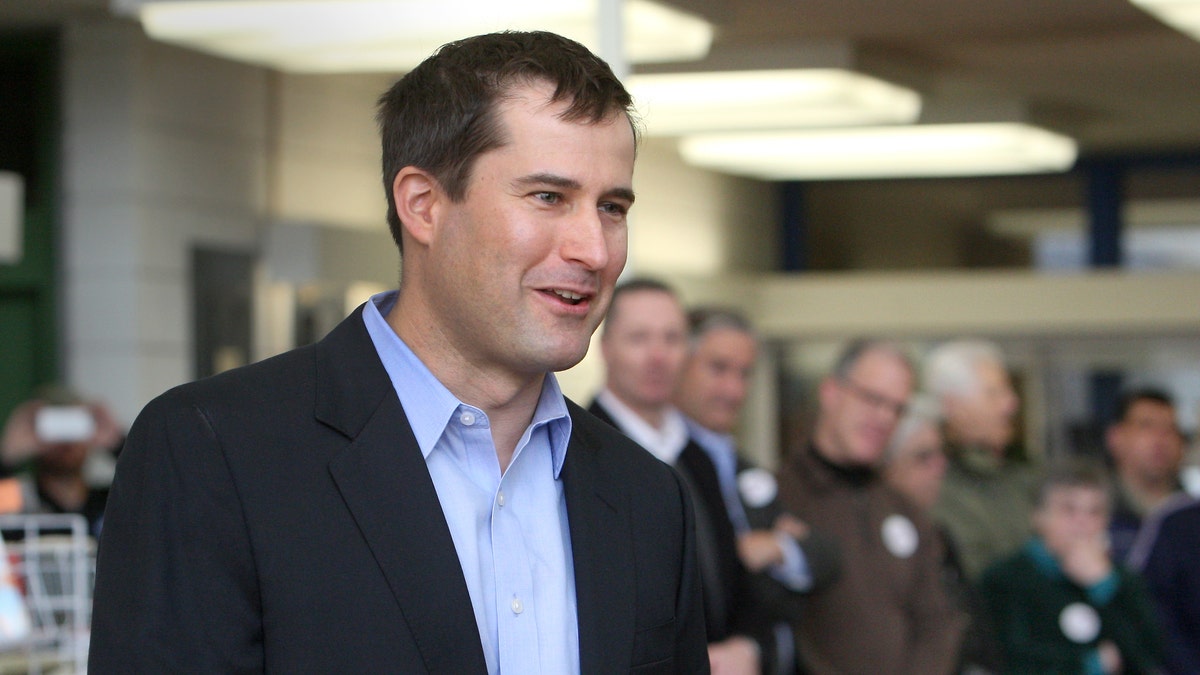 FILE: Seth Moulton speaks at a Democratic caucus in the library of Salem High School in Salem, Mass.