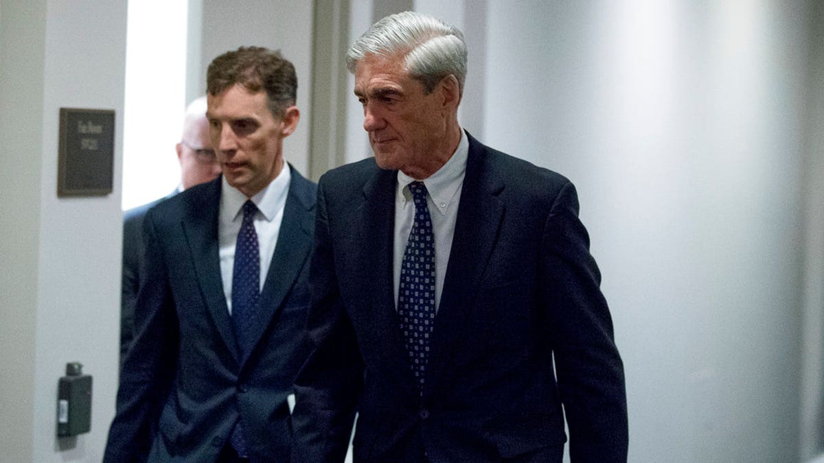 FILE - In this June 21, 2017, file photo, special counsel Robert Mueller departs Capitol Hill following a closed door meeting in Washington. Muellerâs team of investigators has recently questioned a former British spy who compiled a dossier of allegations about President Donald Trumpâs ties to Russia. (AP Photo/Andrew Harnik)