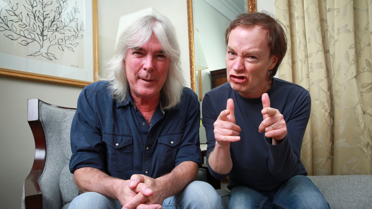 FILE - In this Nov. 13, 2014 file photo, members of the rock band AC/DC, bassist Cliff Williams, left, and guitarist Angus Young pose for a portrait in promotion of their upcoming album, 