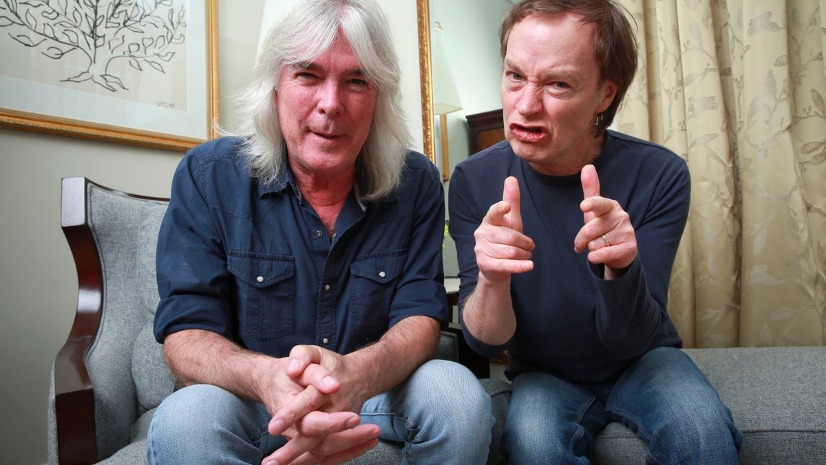 FILE - In this Nov. 13, 2014 file photo, members of the rock band AC/DC, bassist Cliff Williams, left, and guitarist Angus Young pose for a portrait in promotion of their upcoming album,