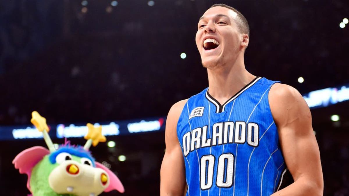Feb 13, 2016; Toronto, Ontario, Canada; Orlando Magic forward Aaron Gordon reacts after a successful dunk over the Magic mascot during the dunk contest during the NBA All Star Saturday Night at Air Canada Centre. Mandatory Credit: Bob Donnan-USA TODAY Sports