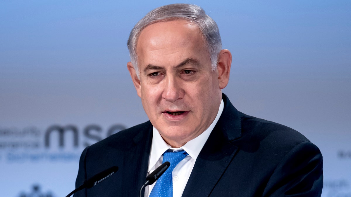 Former Israeli Prime Minister Benjamin Netanyahu, delivers a speech during the International Security Conference in Munich, Germany, Sunday, Feb. 18, 2018. (Sven Hoppe/dpa via AP)