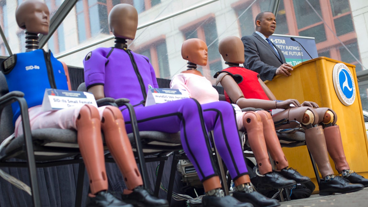 Transportation Secretary Anthony Foxx, with new crash test dummies called &#39;THOR&#39;, during the announcement for plans to update its safety rating system for new cars to include whether the car has technology to avoid crashes, in addition to how well it protects occupants in accidents in Washington, Tuesday, Dec. 8, 2015. In addition, the crash tests will be improved to include accidents in which cars collide at an angle, and they will use improved crash-test dummies that better represent how accidents impact the human body. And the rating system will reward cars designed to protect pedestrians who are struck by them.(AP Photo/Pablo Martinez Monsivais)