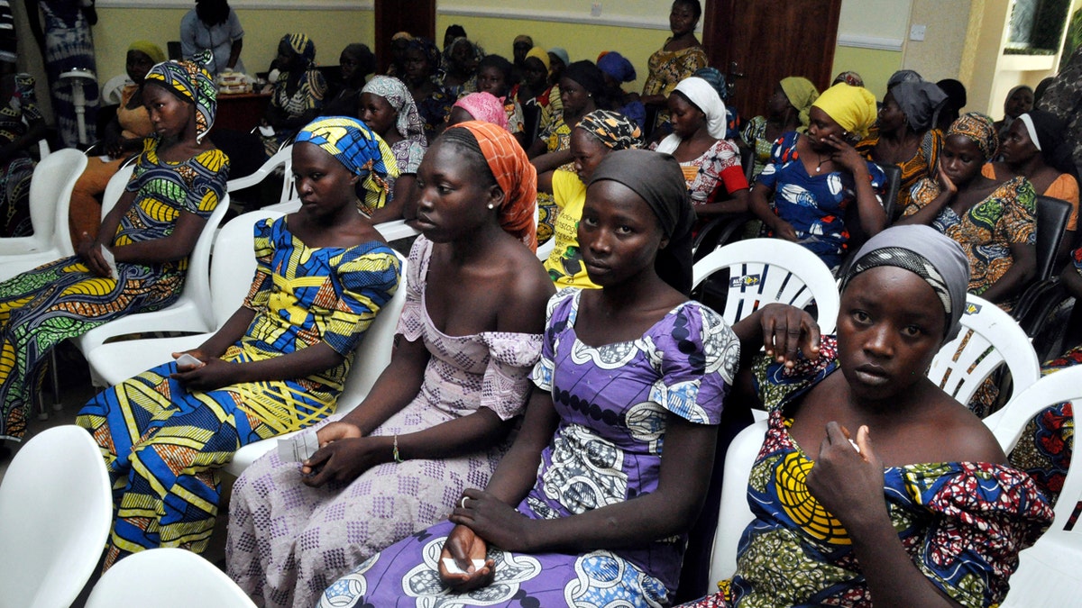 Chibok school girls recently freed from Boko Haram captivity are seen in Abuja, Nigeria, Sunday, May 7, 2017. The 82 freed Chibok schoolgirls arrived in Nigeria's capital on Sunday to meet President Muhammadu Buhari as anxious families awaited an official list of names and looked forward to reuniting three years after the mass abduction. (AP Photo/ Olamikan Gbemiga)