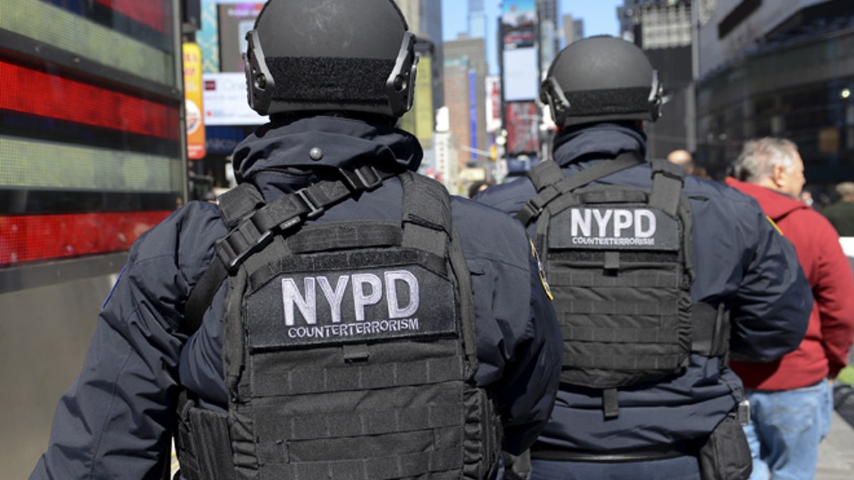 Members of the NYPD Joint Terrorism Task Force patrol in Times Square in the Manhattan borough in New York, March 22, 2016. REUTERS/Stephanie Keith - RTSBRMB