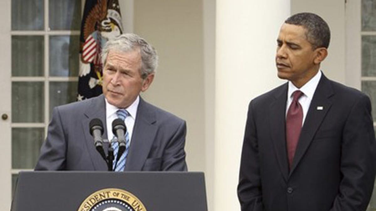 President Obama listens to former President George W. Bush in the Rose Garden of the White House Jan. 16. (Reuters Photo)