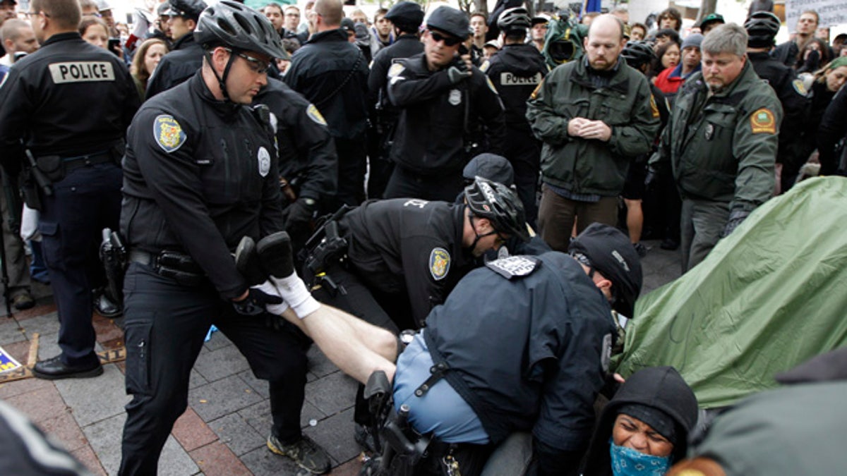 Oct. 5: Police arrest a man who refused to leave a tent pitched at an "Occupy Seattle" protest encampment in downtown Seattle's Westlake Park.