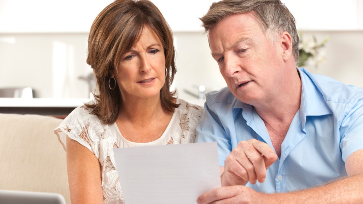 Mature couple worrying about finances