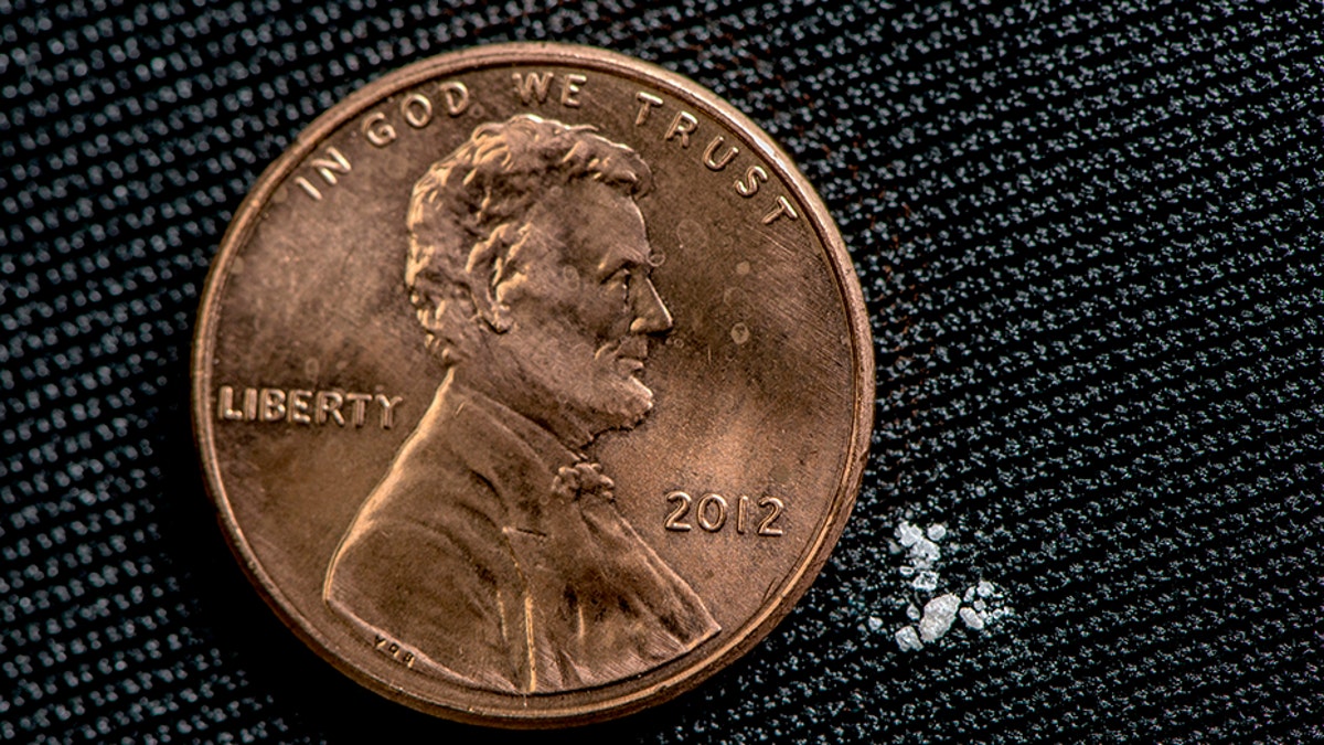 A lethal dose of fentanyl is pictured next to a penny.