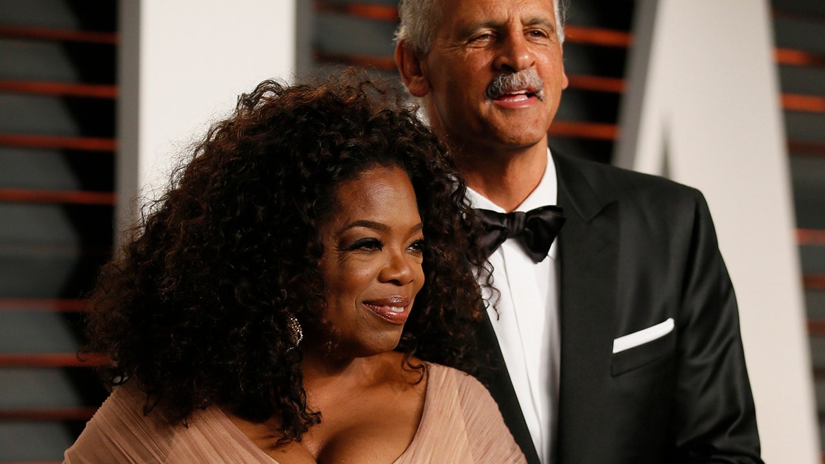 Oprah Winfrey and partner Stedman Graham arrive at the 2015 Vanity Fair Oscar Party in Beverly Hills, California February 22, 2015.