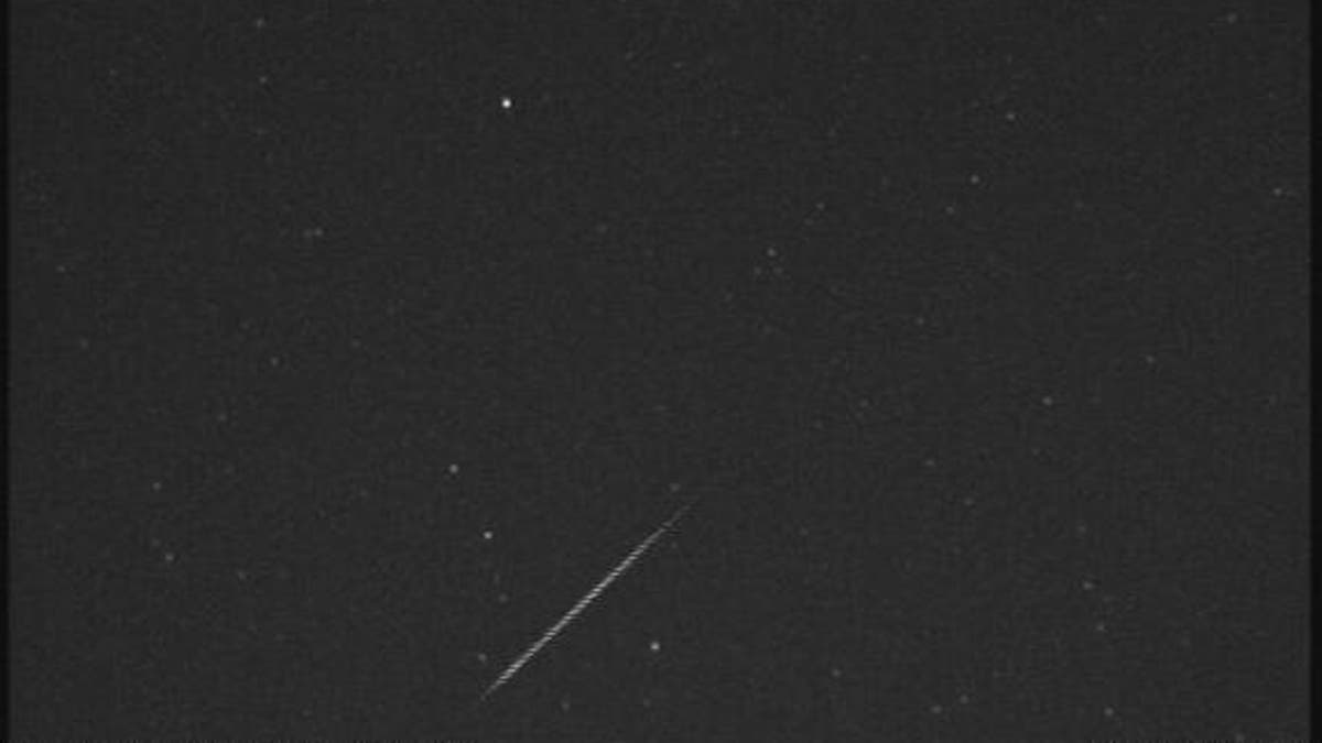 An Orionid meteor streaks across the night sky over Huntsville, Ala., in this view from a camera at NASA's Marshall Space Flight Center before dawn on Oct. 21, 2012, during the peak of the Orionid meteor shower.