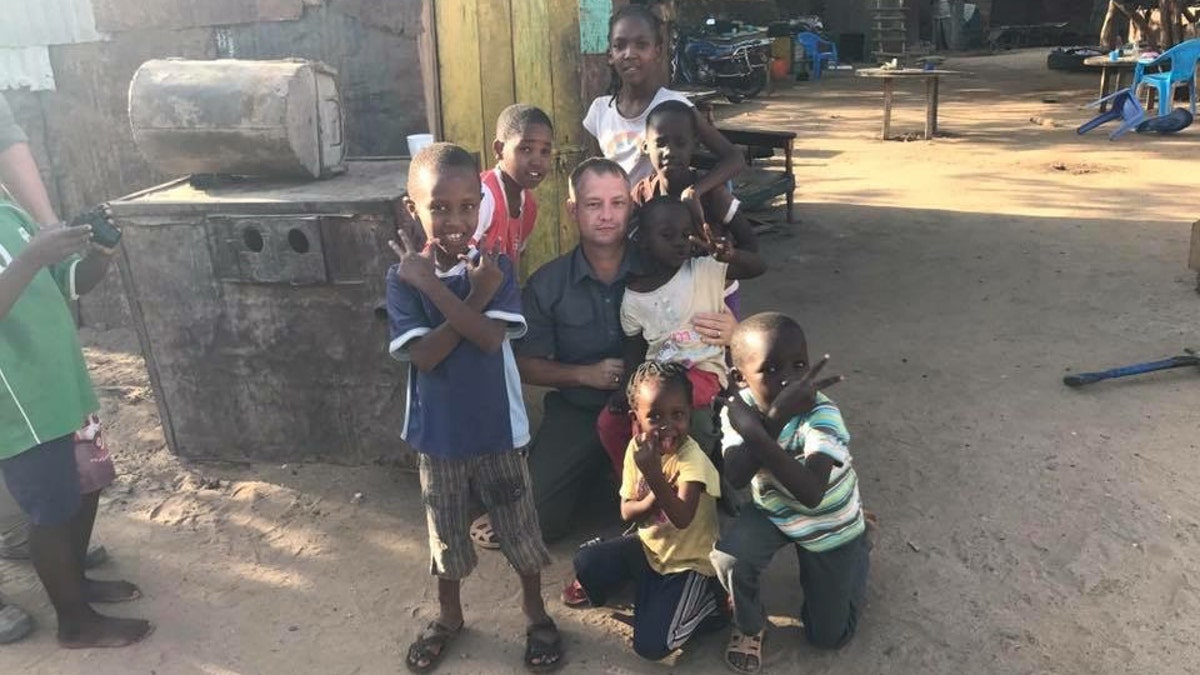 Former Army Reserve Lt. Col. Jason Souza collected 600 pairs of shoes and clothes for the children at a Kenya orphanage school