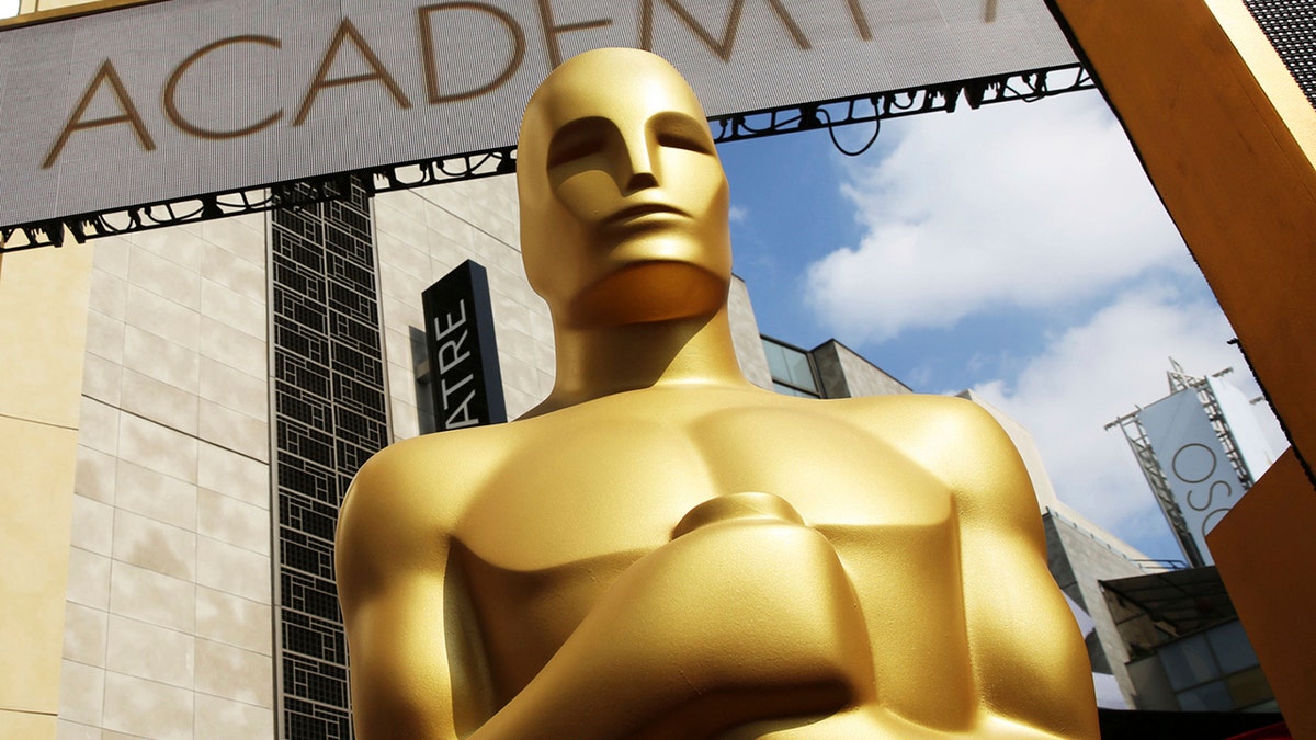 FILE - In this Feb. 21, 2015 file photo, an Oscar statue appears outside the Dolby Theatre for the 87th Academy Awards in Los Angeles. The Oscars are adding a new category to honor popular films and promising a brisk 3-hour ceremony on a much earlier air date of Feb. 9, 2020. (Photo by Matt Sayles/Invision/AP, File)