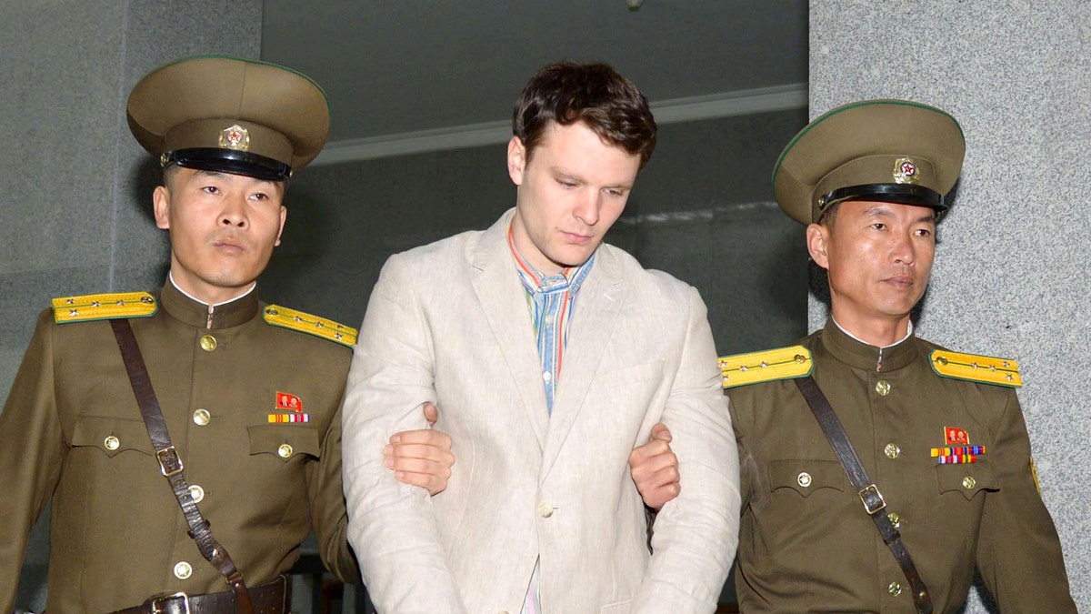 FILE PHOTO - Otto Frederick Warmbier (C), a University of Virginia student who was detained in North Korea since early January, is taken to North Korea's top court in Pyongyang, North Korea, in this photo released by Kyodo March 16, 2016.        Mandatory credit REUTERS/Kyodo   ATTENTION EDITORS - THIS IMAGE HAS BEEN SUPPLIED BY A THIRD PARTY. FOR EDITORIAL USE ONLY. NOT FOR SALE FOR MARKETING OR ADVERTISING CAMPAIGNS. MANDATORY CREDIT.  JAPAN OUT. NO COMMERCIAL OR EDITORIAL SALES IN JAPAN - RTS16VUW