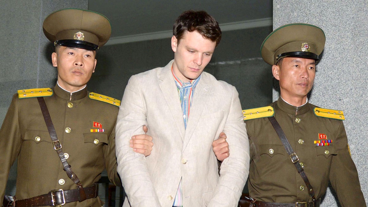 FILE PHOTO - Otto Frederick Warmbier (C), a University of Virginia student who was detained in North Korea since early January, is taken to North Korea's top court in Pyongyang, North Korea, in this photo released by Kyodo March 16, 2016.        Mandatory credit REUTERS/Kyodo   ATTENTION EDITORS - THIS IMAGE HAS BEEN SUPPLIED BY A THIRD PARTY. FOR EDITORIAL USE ONLY. NOT FOR SALE FOR MARKETING OR ADVERTISING CAMPAIGNS. MANDATORY CREDIT.  JAPAN OUT. NO COMMERCIAL OR EDITORIAL SALES IN JAPAN - RTS16VUW