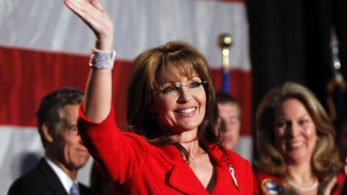 In this May 2, 2011, file photo, former Alaska Governor Sarah Palin waves during a fundraiser at Colorado Christian University in Lakewood, Colo. (AP Photo/Ed Andrieski)