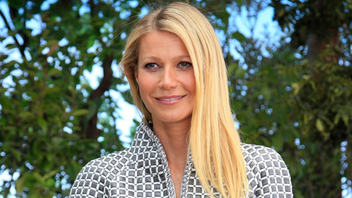 FILE - In this Jan. 26, 2016, file photo, Gwyneth Paltrow poses for photographers before Chanel's Spring-Summer 2016 Haute Couture fashion collection in Paris. Paltrow hosted the inaugural 