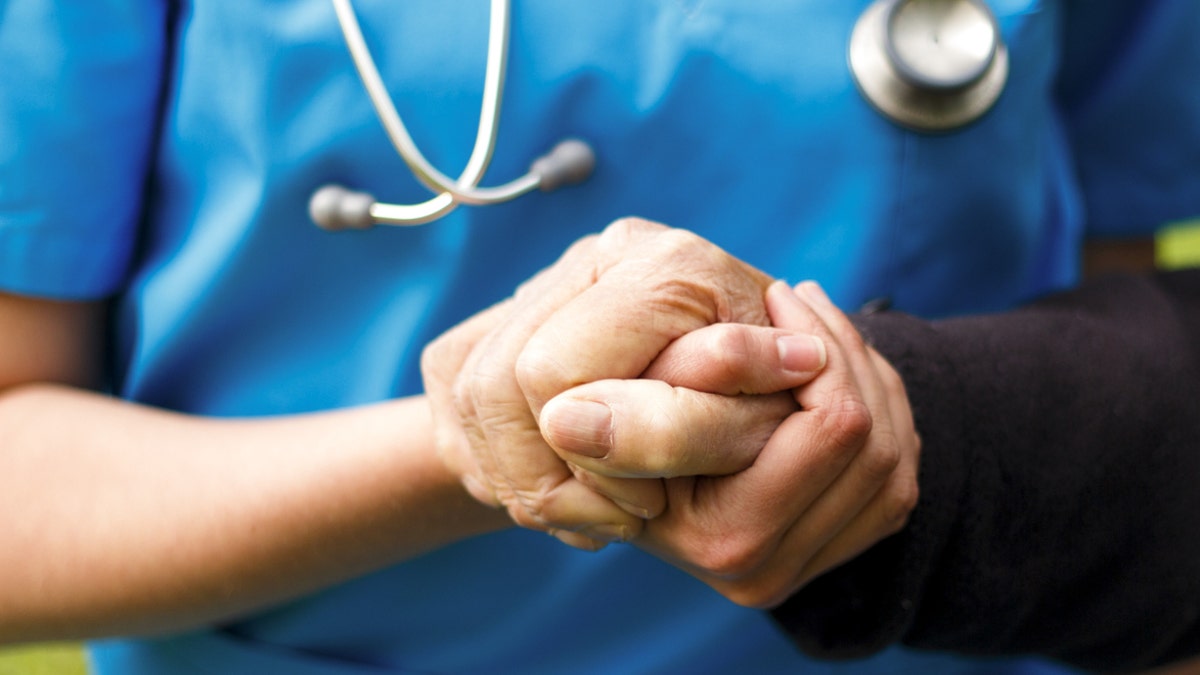 Doctor helping older patient