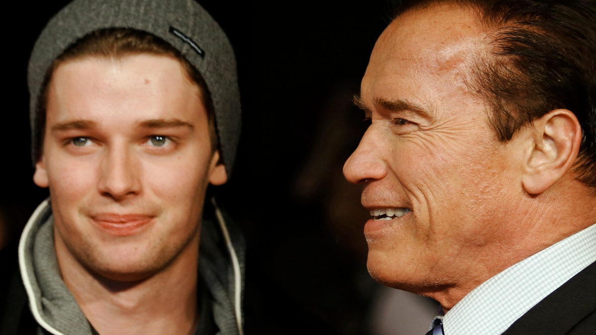 Actor and former California governor Arnold Schwarzenegger (R) poses with his son Patrick as they arrive for the British premiere of 