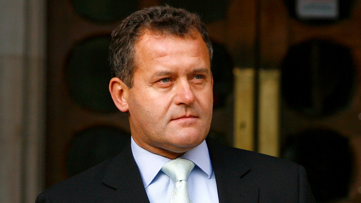 Princess Diana's former butler Paul Burrell poses for photographers at the High Court in London January 14, 2008. Burrell gave evidence to the inquest into the deaths of Princess Diana and Dodi al-Fayed.      REUTERS/Luke MacGregor     (BRITAIN) - LM1DXARDGVAA