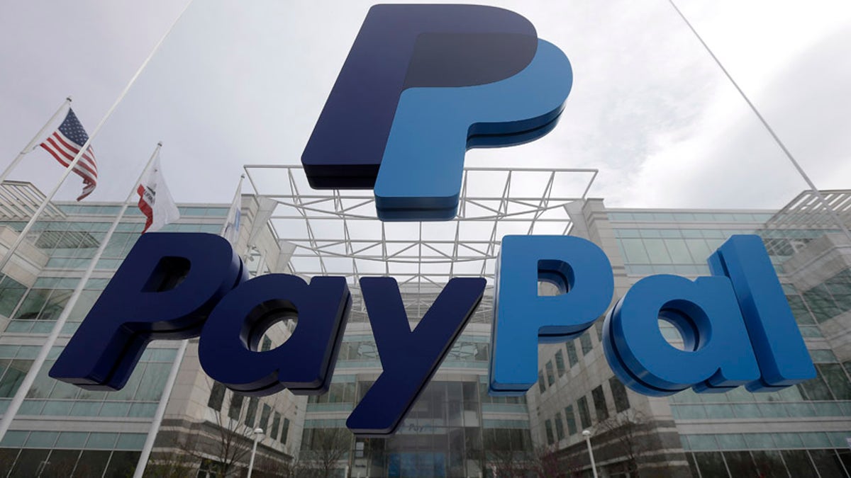 FILE - This March 10, 2015, file photo, shows signage outside PayPal's headquarters in San Jose, Calif. PayPal said on Tuesday, April 5, 2016,  it's canceling plans to bring 400 jobs to North Carolina after lawmakers passed a law that restricts protections for lesbian, gay, bisexual and transgender people. (AP Photo/Jeff Chiu, File)
