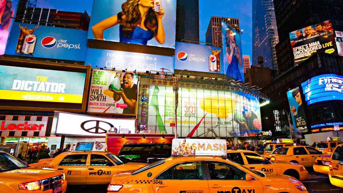 NEW YORK CITY -MARCH 25: Times Square, featured with Broadway Theaters and animated LED signs, is a symbol of New York City and the United States, March 25, 2012 in Manhattan, New York City.