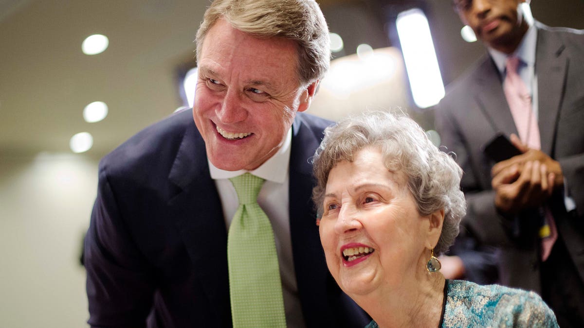 May 20, 2014: Georgia Republican Senate candidate, David Perdue, left, talks with his mother Gervaise Perdue, at an election night party while waiting for results from Georgia's primary election.