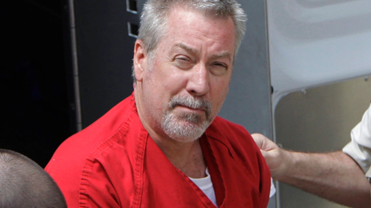 FILE - In this May 8, 2009 file photo, former Bolingbrook, Ill., police officer Drew Peterson arrives for court in Joliet, Ill. Jury selection is set to begin Friday, May 20, 2016, in Chester, Ill., in the murder-for-hire trial of Peterson, who is accused of plotting to kill the prosecutor who put him behind bars in his third wife's death. (AP Photo/M. Spencer Green, File)