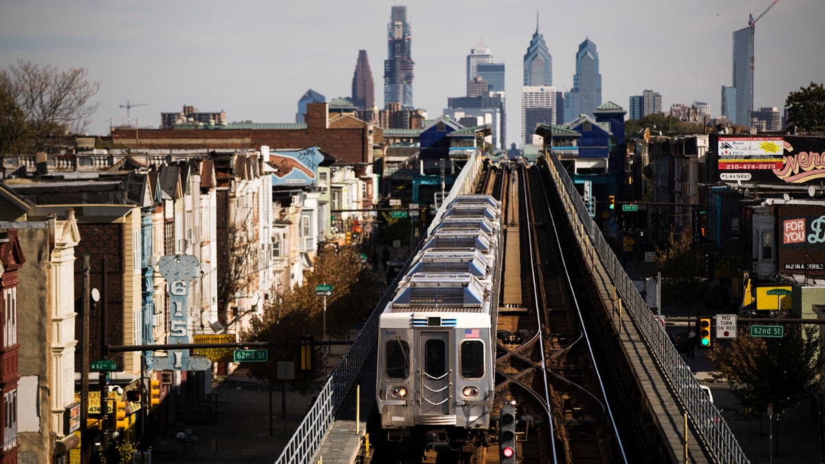A train moves along the Market-Frankford Line in Philadelphia, Wednesday, Oct. 26, 2016. With a strike threat looming for Philadelphia's bus, trolley and subway workers next week, officials are asking customers in the nation's sixth-largest transit system to start figuring out alternate ways to get to work and school. The current contract covering more than 5,700 workers at the Southeastern Pennsylvania Transportation Authority expires at midnight on Monday, and a walkout could begin at the start of service on Nov. 1.(AP Photo/Matt Rourke)
