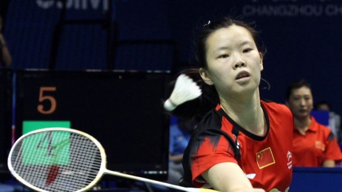 World number-one Li Xuerui, shown September 14, 2013, has pulled out of the badminton Japan Open because of a sore knee, with her teammate linking the problem to a jam-packed schedule for Chinese players.