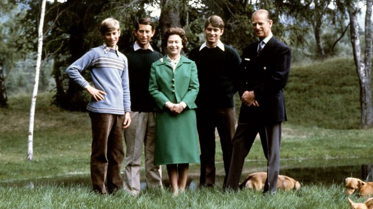 Queen Elizabeth and the Duke of Edinburgh (R) pose with their three sons, Charles, Edward (L), Andrew (2ndR) and the royal corgies in Balmoral Castle, Scotland, November 20, 1979.