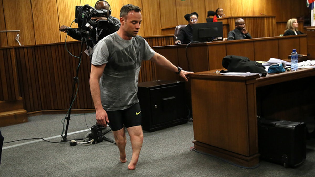 Oscar Pistorius walks on his stumps during a commutation argument by his defense lawyer Barry Roux at the High Court in Pretoria, South Africa, Wednesday, June 15, 2016. An appeals court found Pistorius guilty of murder and no lesser charge for culpable homicide in the shooting death of his girlfriend Reeva Steenkamp.  (AP Photo/Alon Skuy, Pool via AP)