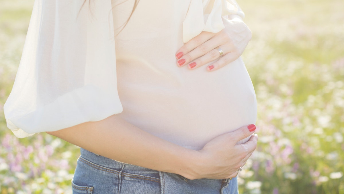 pregnant belly istock