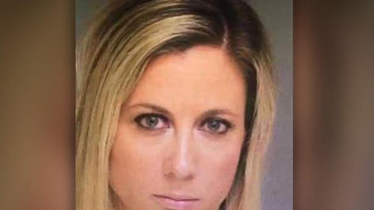 Teacher mom, 31, arrives in court with her husband to face charges she had  sex in her car with teen boy student Fox News photo