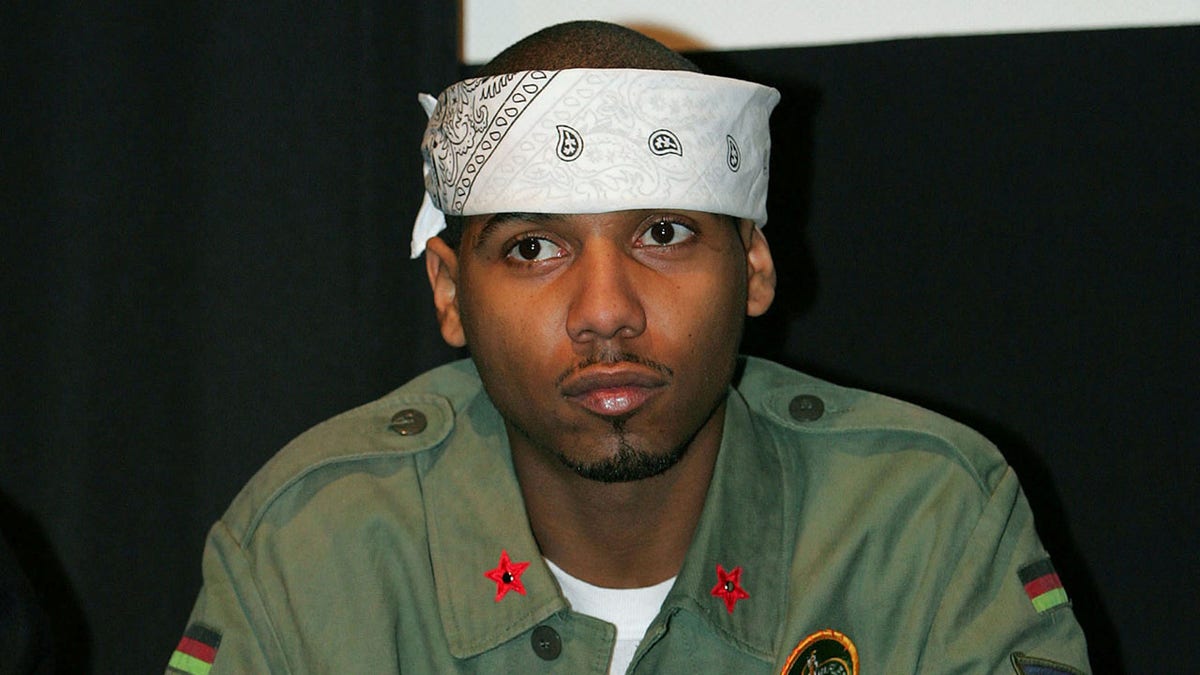 Rap performing artist Juelz Santana sits during CEO of Diplomats Records Cam'Ron's news conference in New York January 25, 2006. Cam'Ron was promoting the release of his movie 