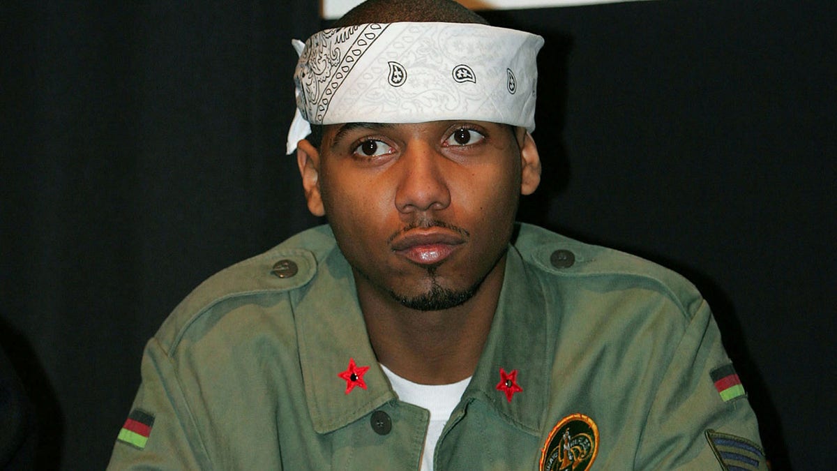 Rap performing artist Juelz Santana sits during CEO of Diplomats Records Cam'Ron's news conference in New York January 25, 2006. Cam'Ron was promoting the release of his movie 